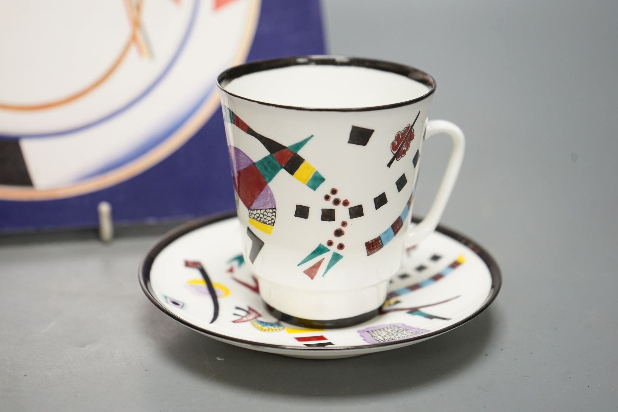 Russian Suprematist-style coffee cup and saucer, 20th century, together with a volume of Revolutionary Ceramics by Nina Lobanov-Rostovsky